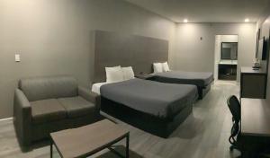 Krevet ili kreveti u jedinici u okviru objekta Americas Best Value Inn & Suites San Benito