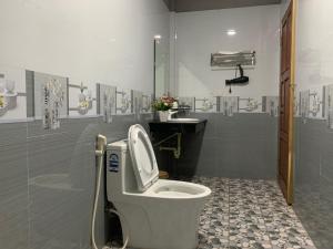 a bathroom with a toilet and a sink at Trang An Homestay in Ninh Binh