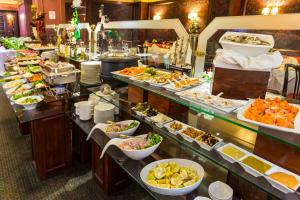 a buffet line with many different types of food at Park Plaza Santiago in Santiago