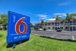 a sign in front of a building with a w hotel at Motel 6-Pomona, CA - Los Angeles in Pomona