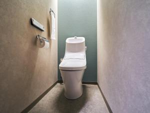 a bathroom with a white toilet in a stall at Rakuten STAY Naha-Miebashi Twin Room in Naha