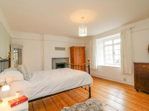 En eller flere senge i et værelse på Brock Cottage