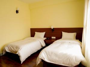 Postel nebo postele na pokoji v ubytování HOTEL CLAIRE INN