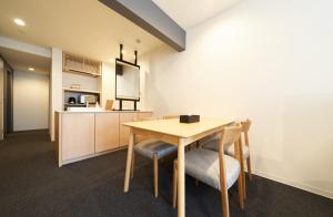 a kitchen and dining room with a table and chairs at Rakuten STAY Osaka Station North Deluxe Fourth in Osaka