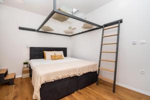 Postel nebo postele na pokoji v ubytování Apartments Kantunal