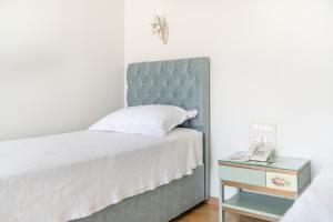 Een bed of bedden in een kamer bij Agia Markella