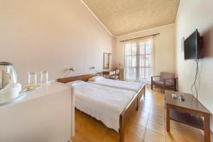 Кровать или кровати в номере Agia Markella