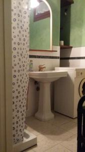 a bathroom with a sink and a mirror at B&B La Salghè in Argenta