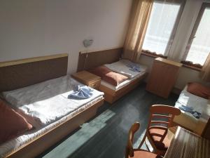 Voodi või voodid majutusasutuse Hotel Sklárna Harrachov toas