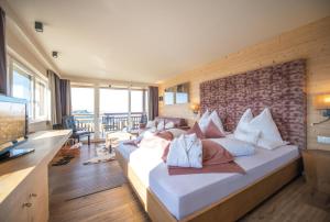Postel nebo postele na pokoji v ubytování Hotel Goldknopf