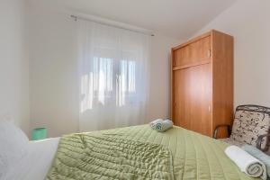 Postel nebo postele na pokoji v ubytování Apartment Marija