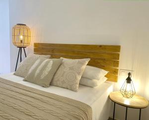 A bed or beds in a room at La Calma Sea Loft - Apartamento Boutique con Vistas