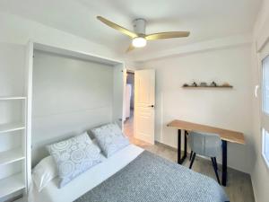 A bed or beds in a room at La Calma Sea Loft - Apartamento Boutique con Vistas