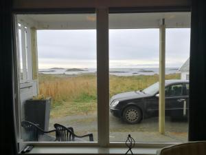 a view of a car parked outside a window at Apt 103 - Andenes Whale Safari Apartments in Andenes +22 photos