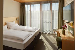 Postel nebo postele na pokoji v ubytování Seehörnle Bio Hotel & Gasthaus