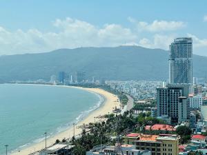 a view of a beach with buildings and the ocean at Armin Homes Altara Residences Quy Nhon in Quy Nhon