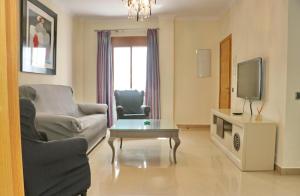 Televízia a/alebo spoločenská miestnosť v ubytovaní Apartamento Teresa planta baja
