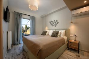 Posteľ alebo postele v izbe v ubytovaní Efilenia Luxury Villas + 37 fotografií