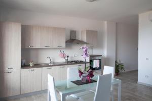 Kuchyňa alebo kuchynka v ubytovaní Airone Residence