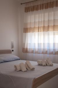 Posteľ alebo postele v izbe v ubytovaní Airone Residence