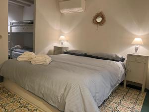 a bedroom with a bed with towels on it at A Casa di Letta in Santa Margherita Ligure