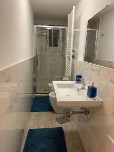 a bathroom with a sink and a toilet and a shower at Palazzo dei Notai in Bologna