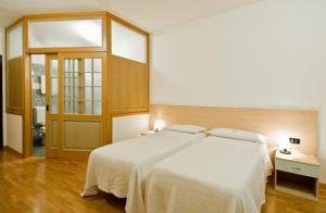 Postel nebo postele na pokoji v ubytování Hotel Europa