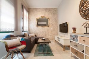 Televízia a/alebo spoločenská miestnosť v ubytovaní Dream Apartments calle Zaragoza