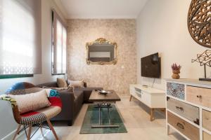 Televízia a/alebo spoločenská miestnosť v ubytovaní Dream Apartments calle Zaragoza