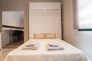 Posteľ alebo postele v izbe v ubytovaní Dream Apartments calle Zaragoza