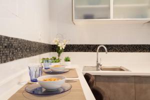 a kitchen with two bowls of food on a counter at Dream Apartments calle Zaragoza in Seville