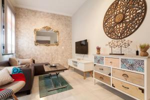 Televízia a/alebo spoločenská miestnosť v ubytovaní Dream Apartments calle Zaragoza
