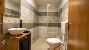 a bathroom with a toilet and a sink at Aida Guest house in Nazareth +32 photos