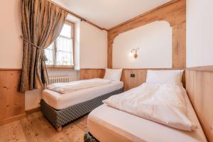 Un pat sau paturi într-o cameră la Maso Margherita