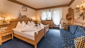 Posteľ alebo postele v izbe v ubytovaní Romantik Hotel Santer + 37 fotografií