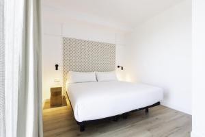 Posteľ alebo postele v izbe v ubytovaní Port Plaza Apartments