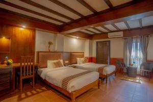 Letto o letti in una camera di Pahan Chhen - Boutique Hotel