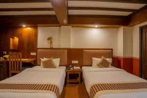 Letto o letti in una camera di Pahan Chhen - Boutique Hotel