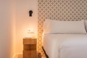 Posteľ alebo postele v izbe v ubytovaní Port Plaza Apartments