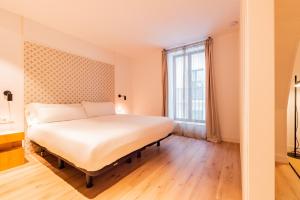 Posteľ alebo postele v izbe v ubytovaní Port Plaza Apartments