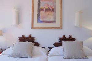 Un pat sau paturi într-o cameră la Hotel Madreselva