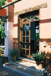 
a door is open to a large brick building at Hotel Madreselva in Los Caños de Meca
