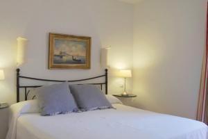 Кровать или кровати в номере Hotel Madreselva - Grupo Califa