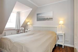 Ένα ή περισσότερα κρεβάτια σε δωμάτιο στο Ostseewelle Wohnung 26