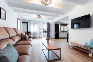 a living room with a couch and a table at Villa Maria in Murcia