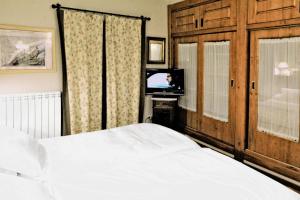 Postel nebo postele na pokoji v ubytování Chardín d'Alto-Apartamentos Chardins