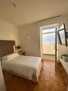 A bed or beds in a room at Albergo Del Sole