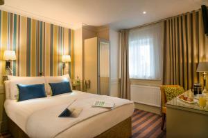 Ένα ή περισσότερα κρεβάτια σε δωμάτιο στο The Marcy Hotel