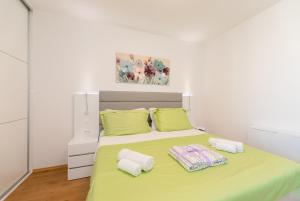 Posteľ alebo postele v izbe v ubytovaní Split Sky Apartment