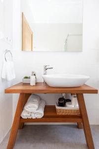 a bathroom vanity with a sink and a mirror at Aresti Old Town by Bilbao Living in Bilbao